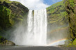 Skogarfoss on the Iceland with a rainbow