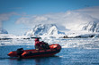 man in the red boat