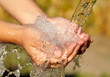 Woman's hands with water splash