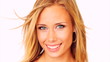 Happy young woman looking and smiling over white background
