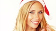 Beautiful young girl wearing santa hat posing