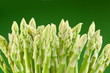 Sheaf of asparagus on a green background. Sheaf of asparagus on a green background.