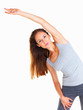 Photo: Woman concentrating while stretching Woman concentrating while stretching