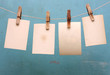 vintage photograph hang on the clothespin isolated on blue wall vintage photograph hang on the clothespin isolated on blue wall