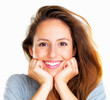 Cheerful woman resting face in hands