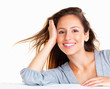 Pretty woman resting head against hand