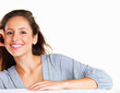 Happy woman resting with her head on hand