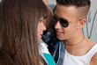 Young couple urban fashion flirting close-up portrait