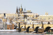 First Snow in Prague, gothic Castle with the Charles Bridge First Snow in Prague, gothic Castle with the Charles Bridge