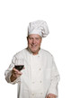 Happy chef with a glass of wine