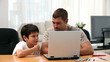 Video: Father and son watching something on the laptop at home Father and son watching something on the laptop at home