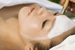 Young woman having facial treatment, close-up