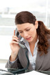 Concentrated businesswoman talking on the phone