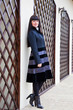 Foto: A woman is near the wall A woman is near the wall