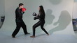 Girl boxing match with a man