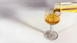 Filling a glass of brandy