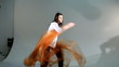 Girl dancing with the canvas of organza