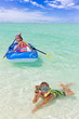 Children playing in ocean
