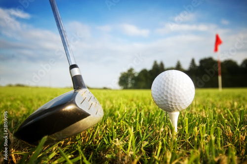 Photo: Playing golf. Club and ball on tee Playing golf. Club and ball on tee