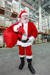Photo: Happy Santa Claus with red sack in storehouse Happy Santa Claus with red sack in storehouse