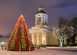 decorated Christmas tree in front of church night scene decorated Christmas tree in front of church night scene