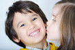 Photo: Adorable toddler girl kissing her brother Adorable toddler girl kissing her brother