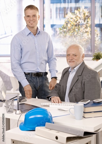 Photo: Portrait of senior and junior businessmen Portrait of senior and junior businessmen