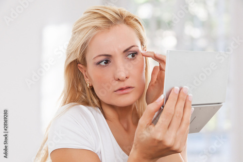 Photo: Beauty woman worrying about puckers Beauty woman worrying about puckers