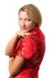 Woman in red chinese dress cheongsam with saucy smile