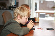 Photo: Boy drinking hot chocolate Boy drinking hot chocolate