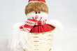 Snow man toy in a golden box decoration isolated Snow man toy in a golden box decoration isolated
