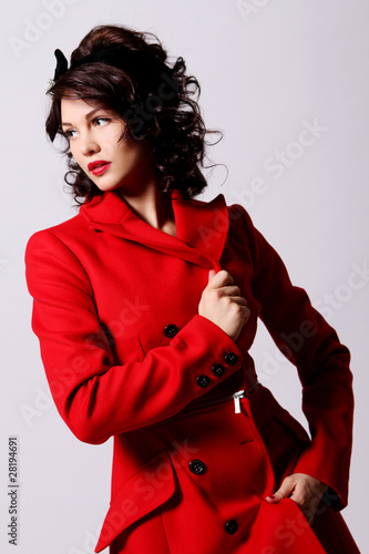 Photo: Beautiful young woman in red coat Beautiful young woman in red coat