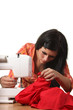Seamstress work on the sewing-machine Seamstress work on the sewing-machine