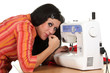 Seamstress work on the sewing-machine Seamstress work on the sewing-machine