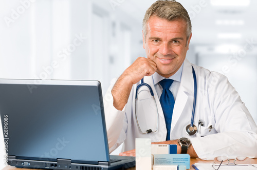Photo: Doctor working in office Doctor working in office
