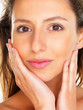 Close up of woman with hands on face