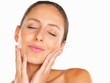 Pretty woman holding her face