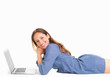 Woman laying in front of laptop