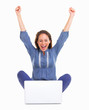 Excited woman sitting in front of laptop