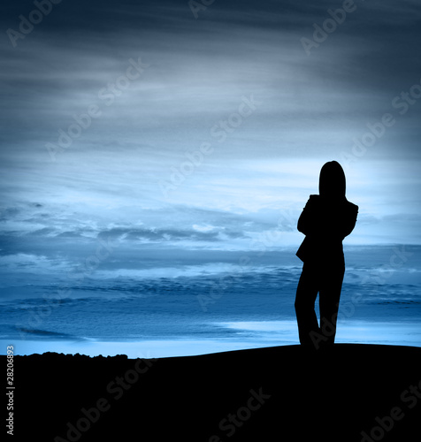 Photo: Silhouette of woman standing Silhouette of woman standing