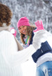 Couple playing snowballs