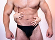 Woman's hands on a sexy man's torso