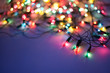 Christmas lights on dark blue background with copy space. Decora Christmas lights on dark blue background with copy space. Decora