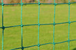 Photo: Net with green grass on background Net with green grass on background