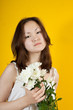 Young girl and white chrysanthemums