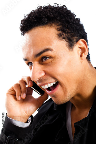 Foto: junger Mann beim telefonieren junger Mann beim telefonieren