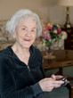 Elderly Woman on Blackberry Smiling