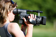Foto: Woman with video camera Woman with video camera