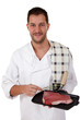 Young attractive caucasian male cook, t-bone steak