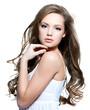 Beautiful teen girl with  long curly hairs